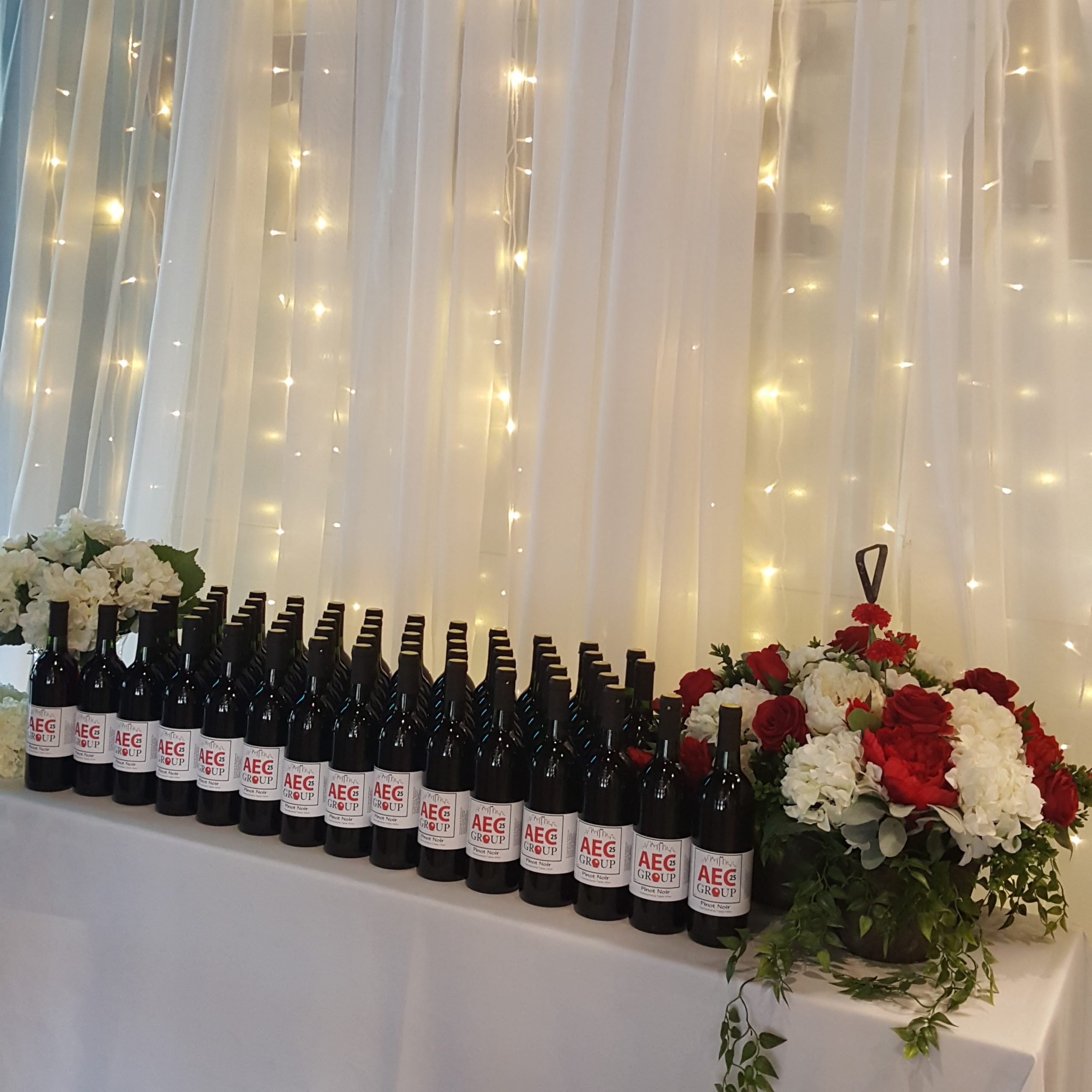a table topped with lots of bottles of wine